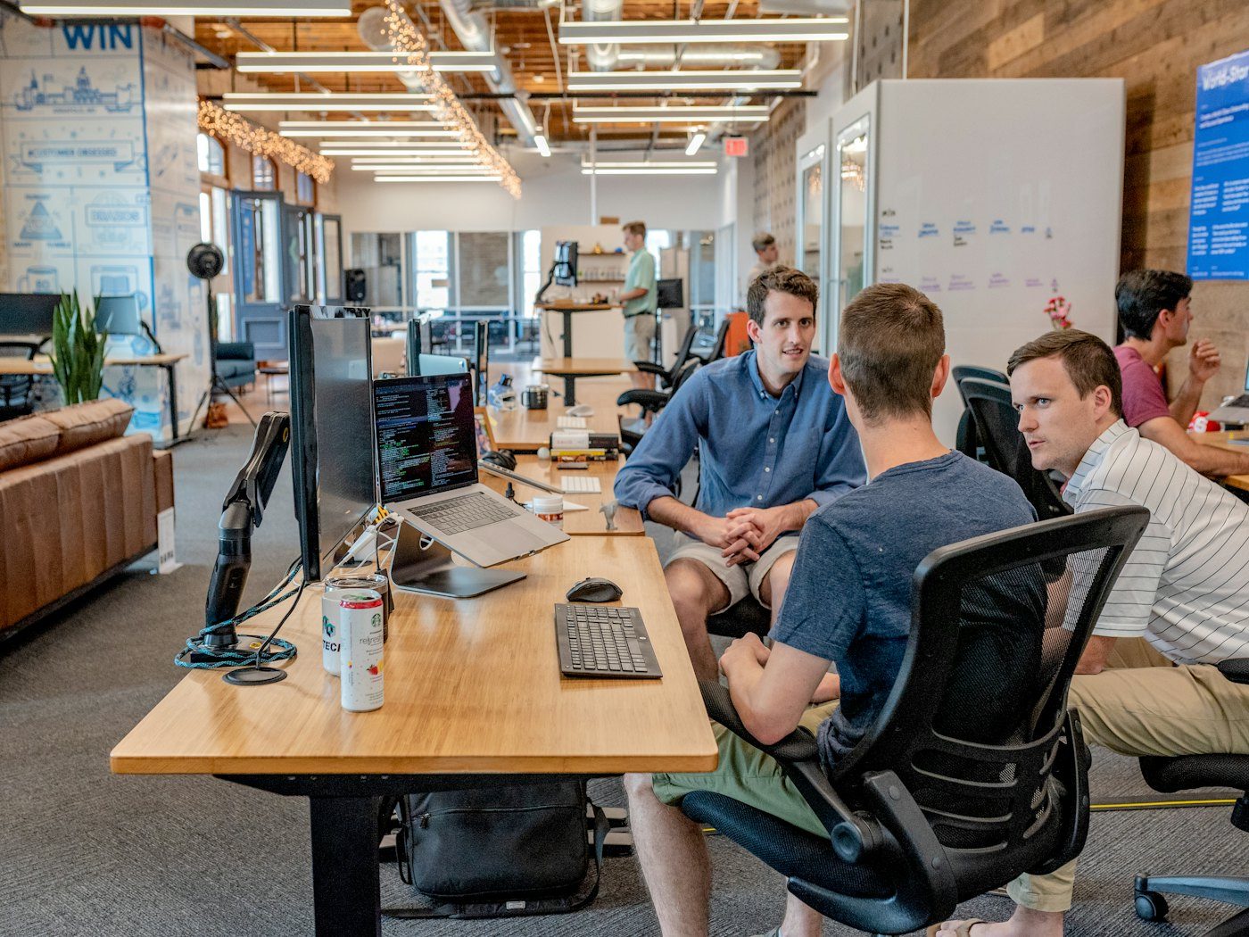 A small team in discussion around a table